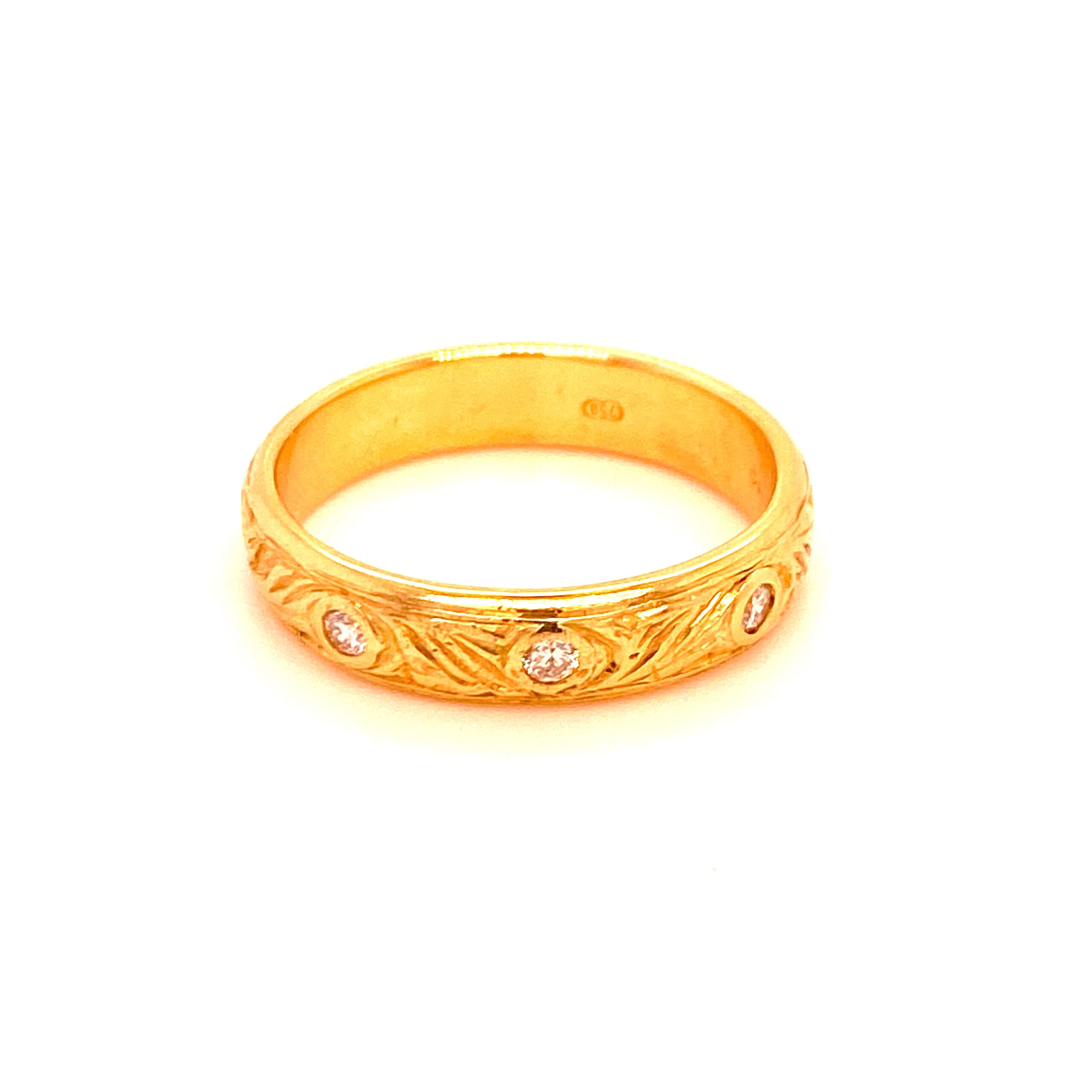 Wide engraved antique inspired gold band with diamonds
